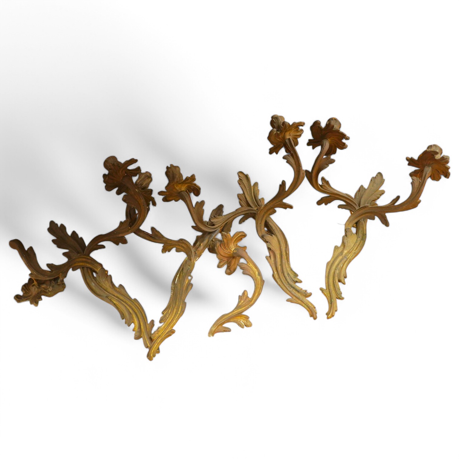 A set of four brass two branch wall scones, 37cm high. Condition - one branch broken.